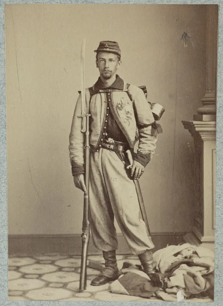 Francis E. Brownell, Pvt. 11th New York Infantry. First person to receive the Medal of Honor. This picture was taken soon after the killing. Pvt. Brownell can be seen standing on the Confederate flag that was flying above Jackson's Inn.